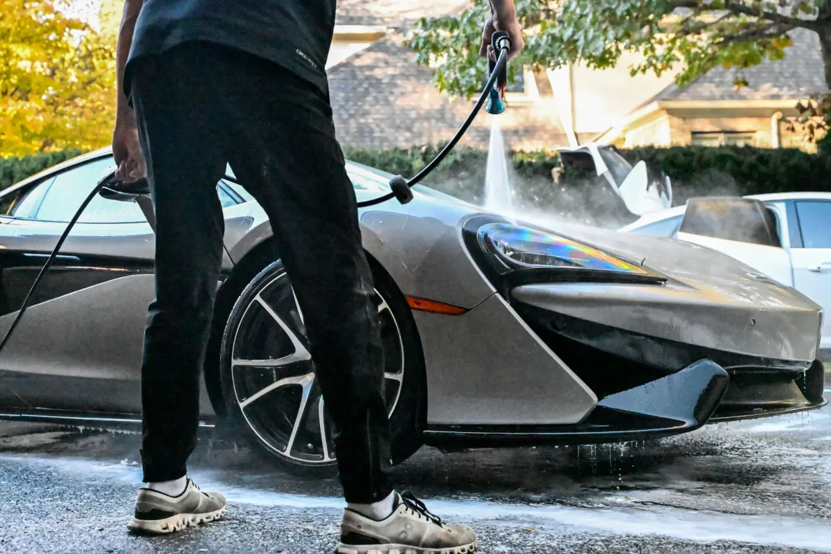 Rinsing foam off the front of the McLaren